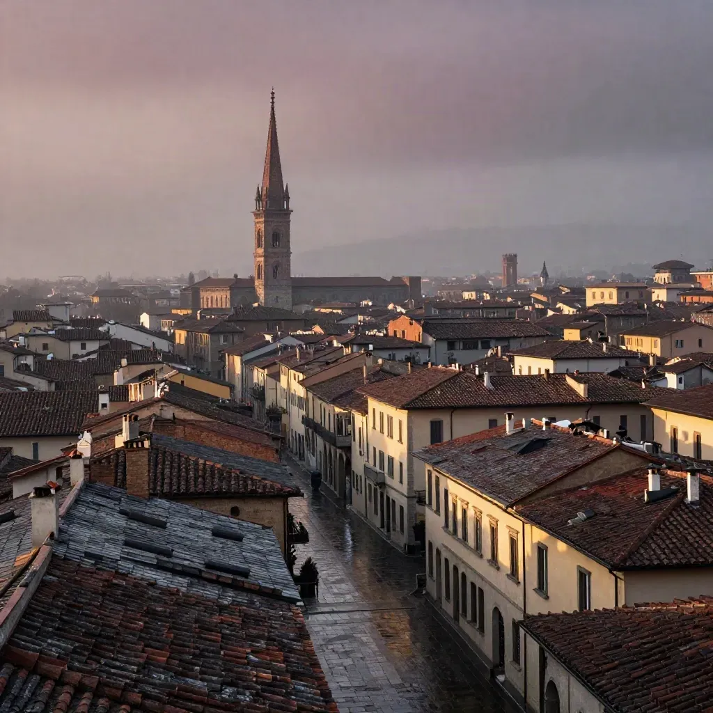 Tetti di Brera e guglia del Duomo nella nebbia del mattino dopo la pioggia.